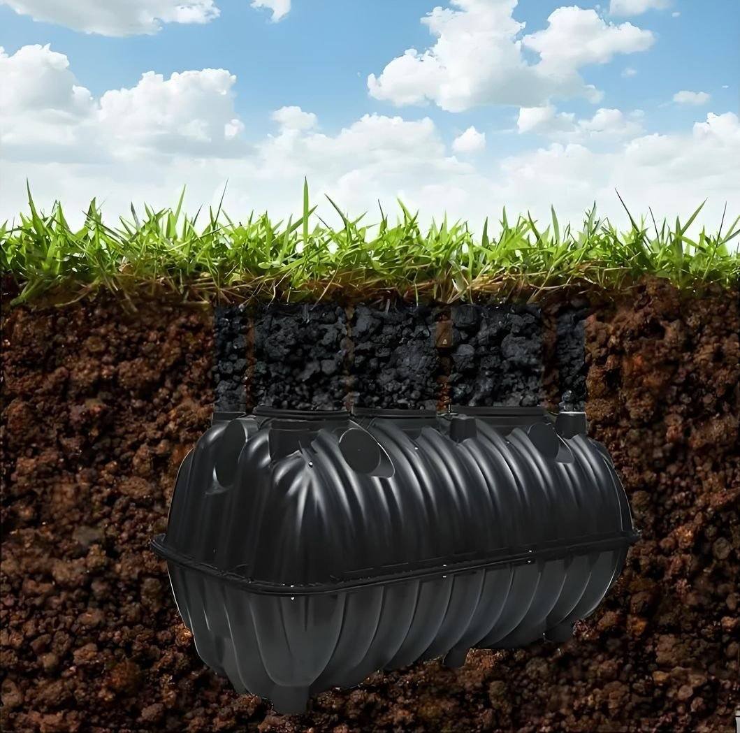 Rotomolded three-chamber septic tank for underground rural sewage treatment, site installation scene.